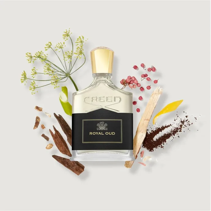 Flacon Creed Royal Oud accompagné de bois, d'épices et de fleurs